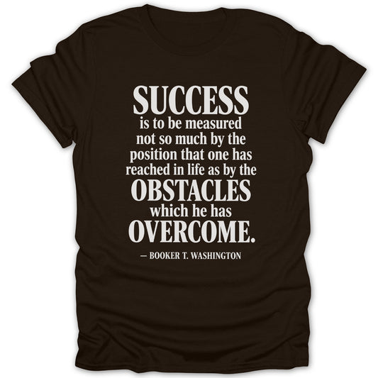 A brown crew-neck t-shirt featuring the white Booker T. Washington quote about success and obstacles overcome.