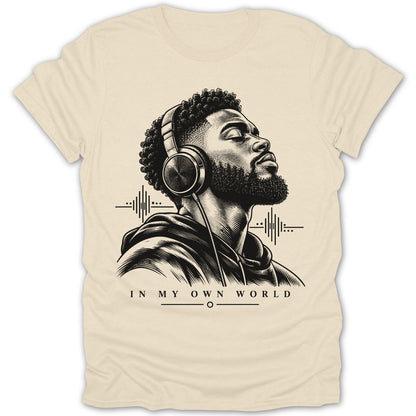 Black and white graphic of a man with headphones listening to music, text "IN MY OWN WORLD".