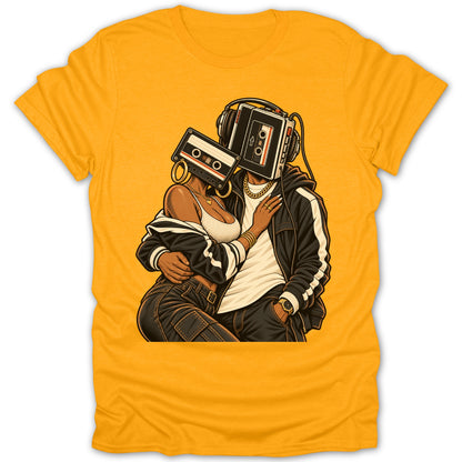 Couple with cassette tapes for heads wearing headphones and jewelry embrace on yellow shirt.