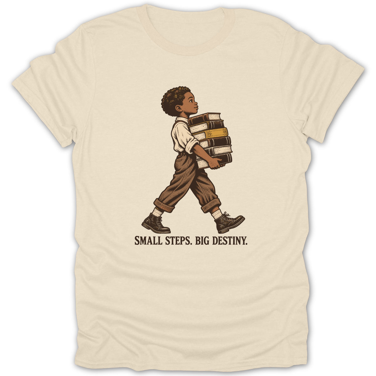 Child carrying books on a beige t-shirt with text "SMALL STEPS. BIG DESTINY."