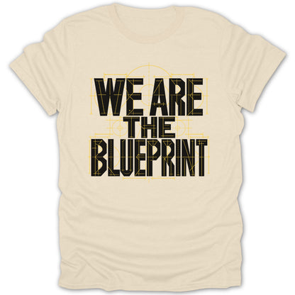 Light beige t-shirt with black text "WE ARE THE BLUEPRINT" in stencil font.