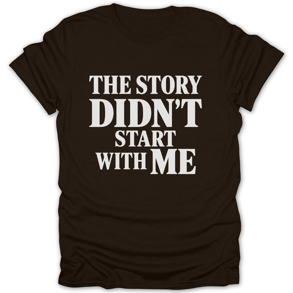 A dark brown short-sleeved t-shirt featuring white text that reads "THE STORY DIDN'T START WITH ME".