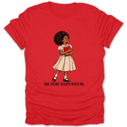 Red t-shirt with drawing of a girl holding a book and text "THE STORY STARTS WITH ME."