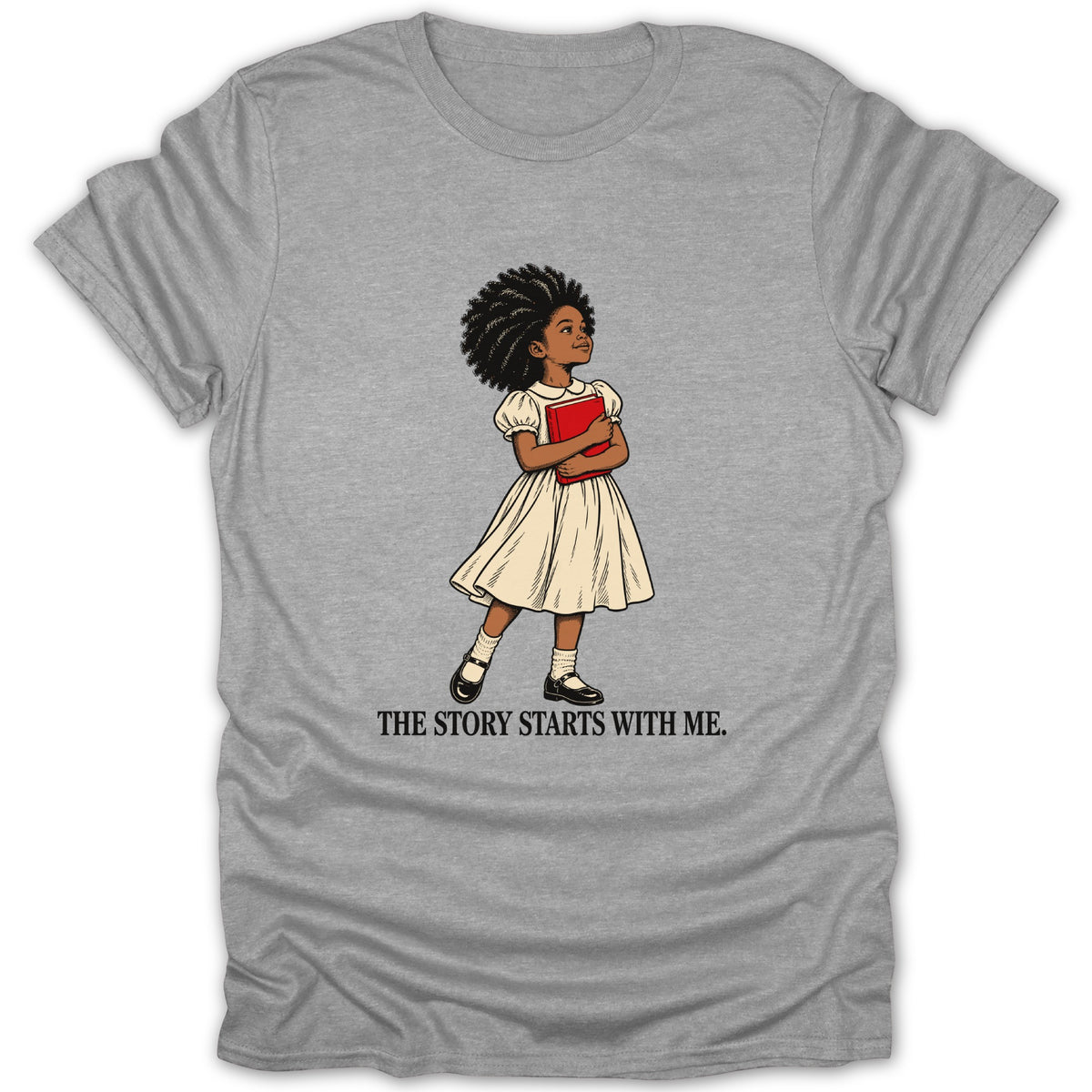 Illustration of a girl holding a book on a gray t-shirt with "The Story Starts With Me" text.