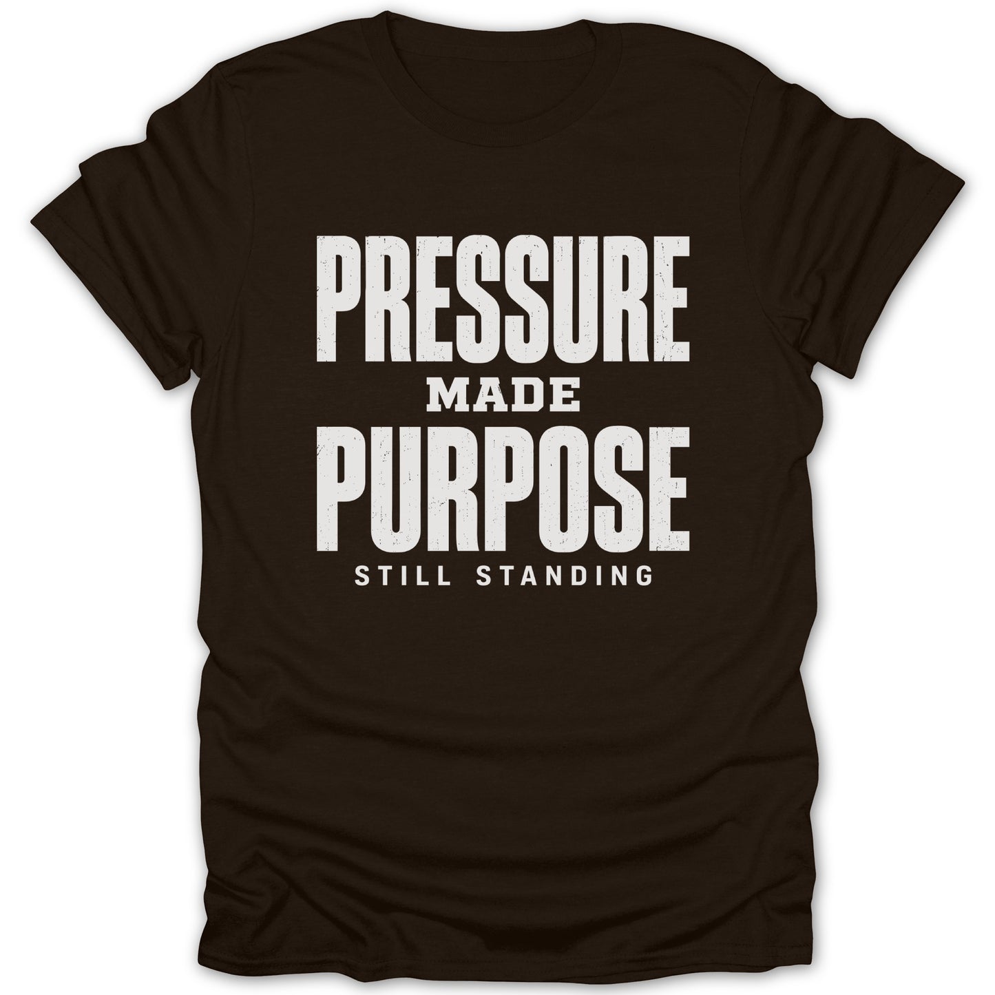 Brown t-shirt with white text "PRESSURE MADE PURPOSE STILL STANDING".