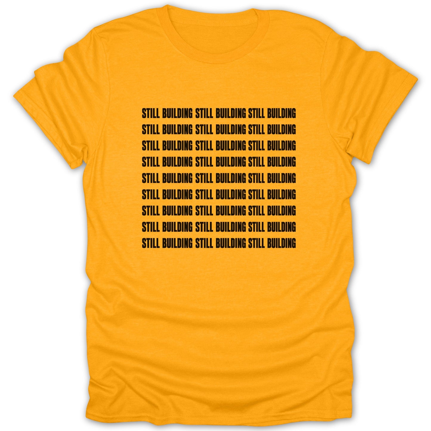 Orange t-shirt with black text repeating "STILL BUILDING" in rows.