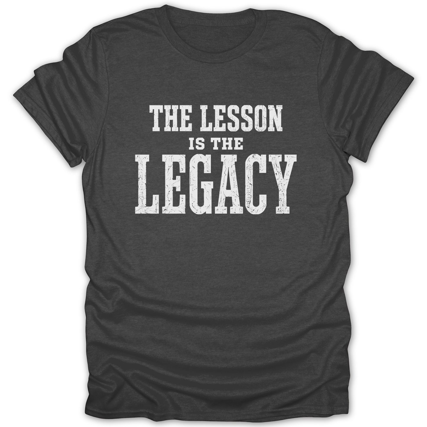 Dark gray t-shirt with white text reading "THE LESSON IS THE LEGACY".