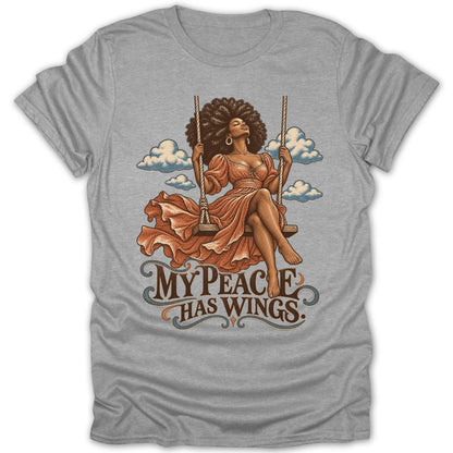 Woman with afro on a swing, text reads "My Peace Has Wings".