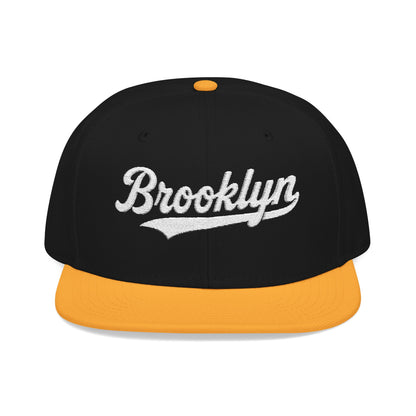 Black and orange Brooklyn snapback hat with white embroidered lettering.