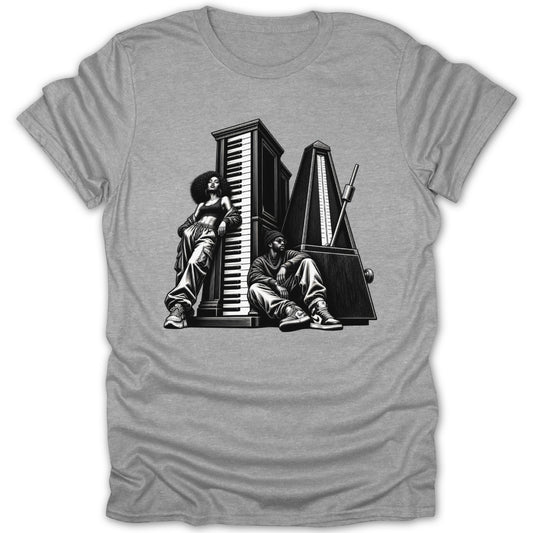 Black and white graphic of two people with a piano and metronome on a grey t-shirt.