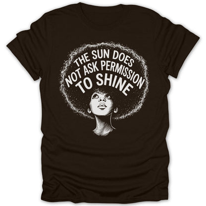 Brown t-shirt with a woman's portrait and text: "The sun does not ask permission to shine."