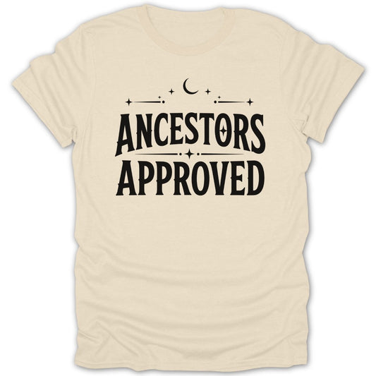 Cream t-shirt with black text that reads "ANCESTORS APPROVED" with celestial accents.