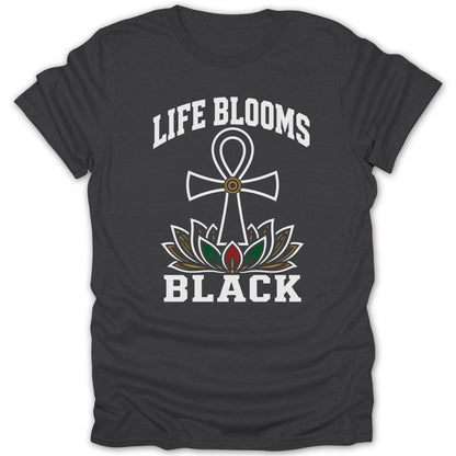 Dark t-shirt with white text "LIFE BLOOMS BLACK" and a lotus flower with an ankh.