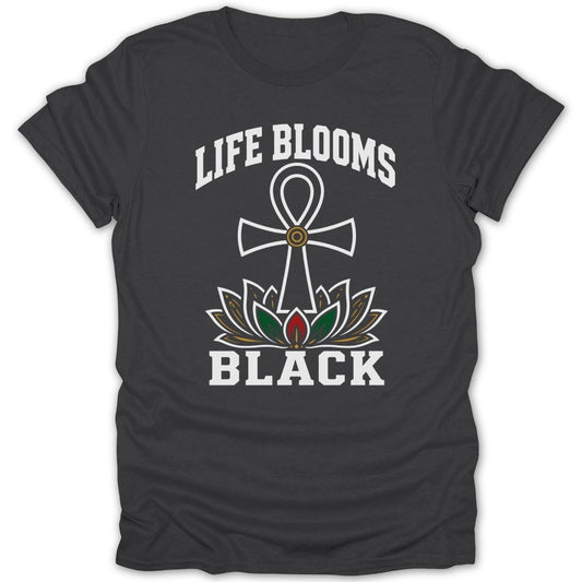 Dark t-shirt with white text "LIFE BLOOMS BLACK" and a lotus flower with an ankh.