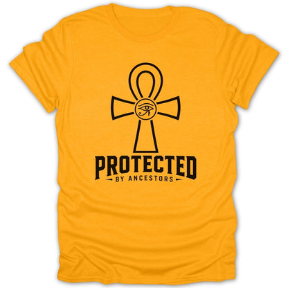 Yellow t-shirt with black ankh symbol and "PROTECTED BY ANCESTORS" text.