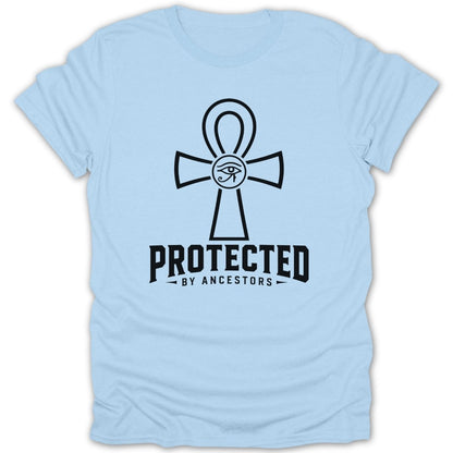 Light blue t-shirt with black "PROTECTED BY ANCESTORS" text and Egyptian ankh symbol.