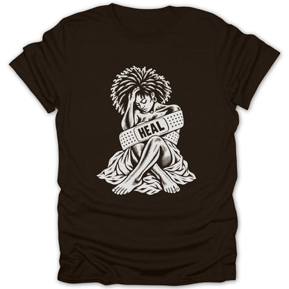 Black t-shirt with white graphic of person wrapped in bandages labeled "HEAL".