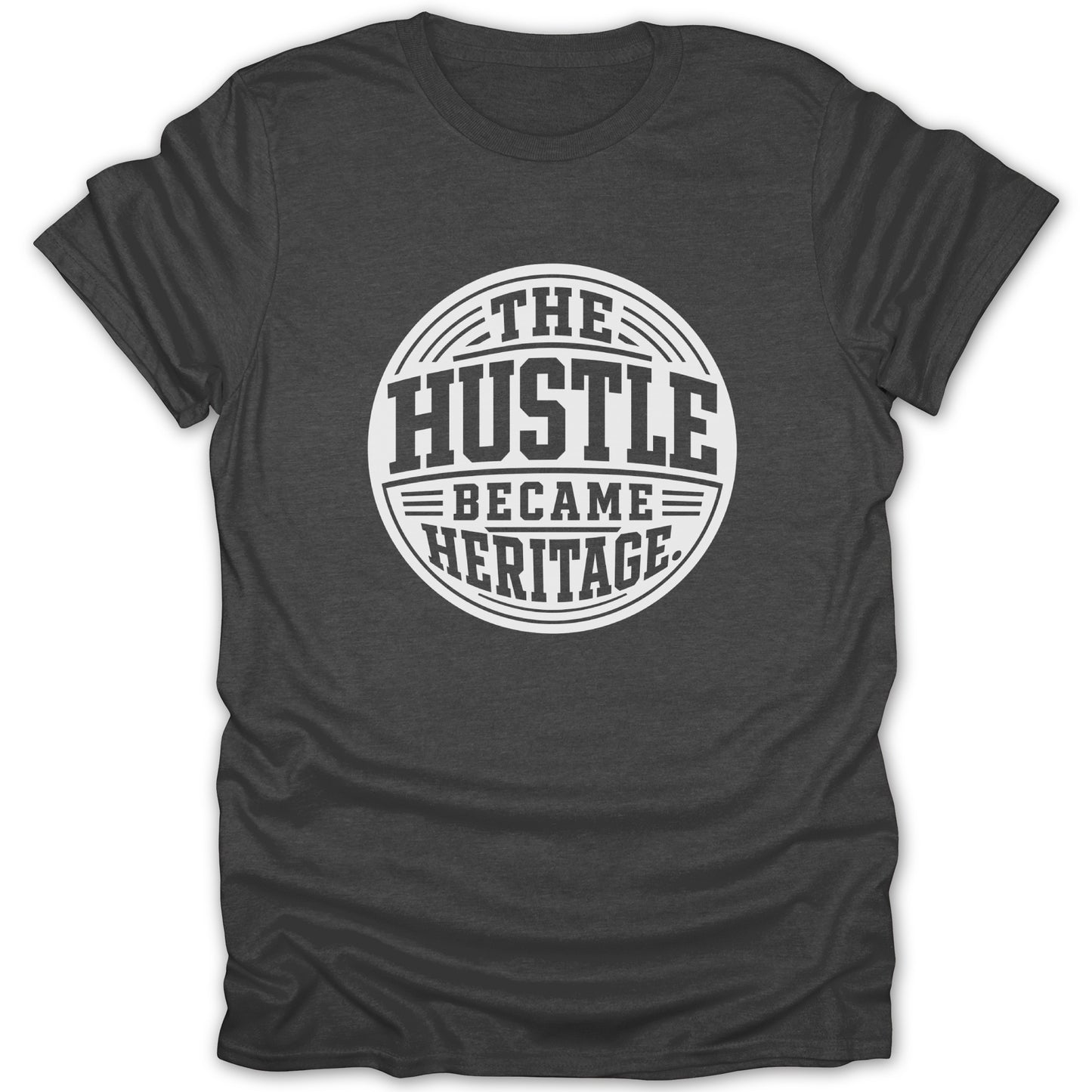 Dark grey t-shirt with white text: "The Hustle Became Heritage."