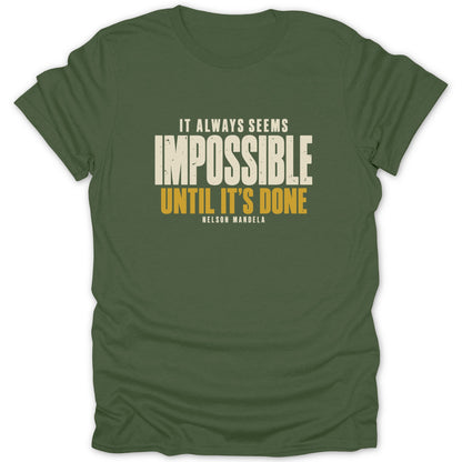 An olive green t-shirt with the text "IT ALWAYS SEEMS IMPOSSIBLE UNTIL IT'S DONE NELSON MANDELA".
