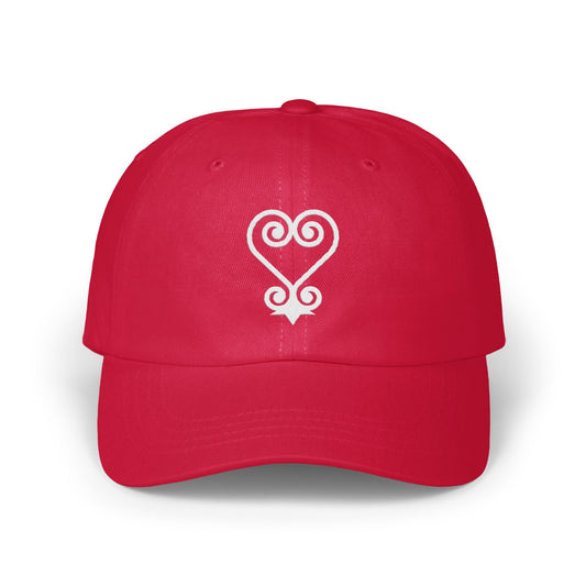 Red baseball cap with white Adinkra symbol Gye Nyame.