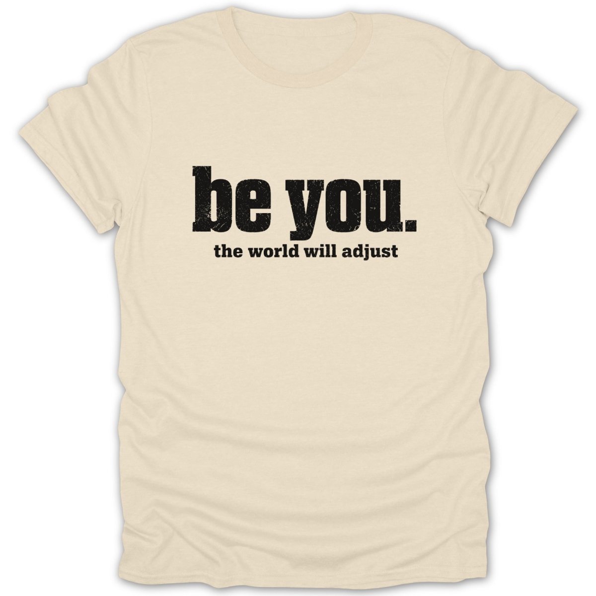 Cream t-shirt with "be you. the world will adjust" in black text.