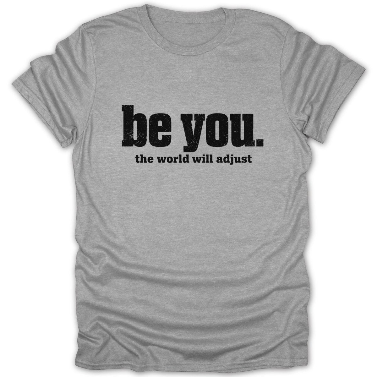 Grey t-shirt with "be you. the world will adjust" printed in black.