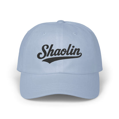 Light blue baseball cap with "Shaolin" in black script text.
