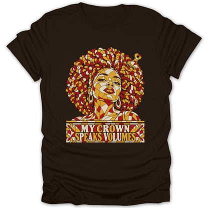 Dark brown t-shirt featuring a mosaic art graphic of a Black woman with natural hair and text reading My Crown Speaks Volumes.
