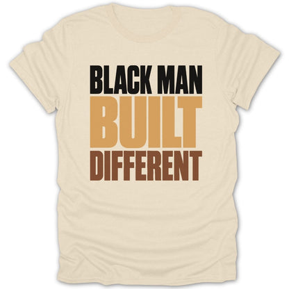 Cream t-shirt with black, tan, and brown text reading "BLACK MAN BUILT DIFFERENT".
