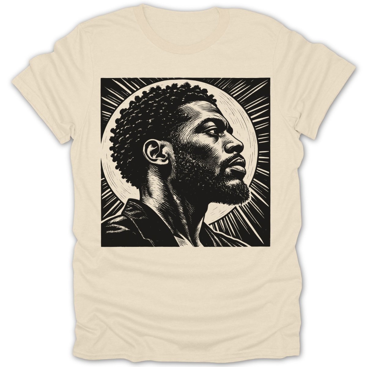 Black and white linocut art of a man with afro and beard on a light cream t-shirt.