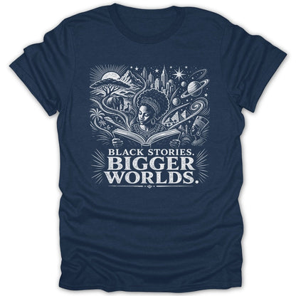 T-shirt graphic with woman reading, African landscape, city, and planets. Text: BLACK STORIES. BIGGER WORLDS.