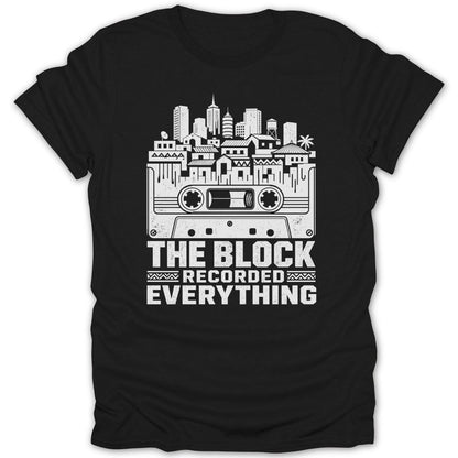 Black t-shirt with white graphic of a cassette tape, city skyline, and text.