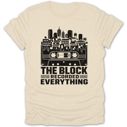 T-shirt with black graphic of cassette tape and cityscape, reading "The Block Recorded Everything."