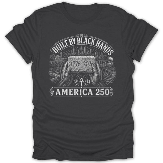 Dark t-shirt with "Built by Black Hands" text, hands holding a brick, and cityscape.