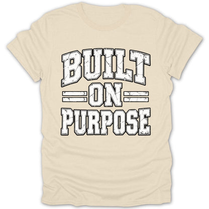 Cream t-shirt with distressed "BUILT ON PURPOSE" text in block letters.
