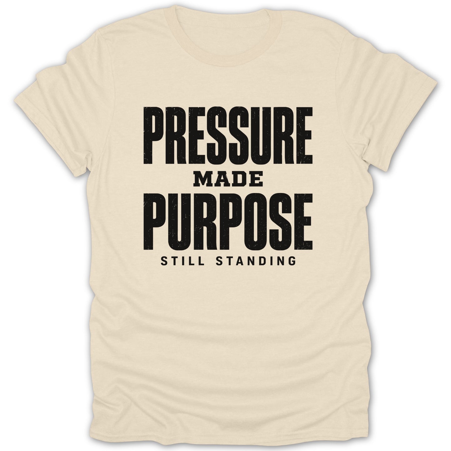 Cream t-shirt with black text "PRESSURE MADE PURPOSE STILL STANDING".