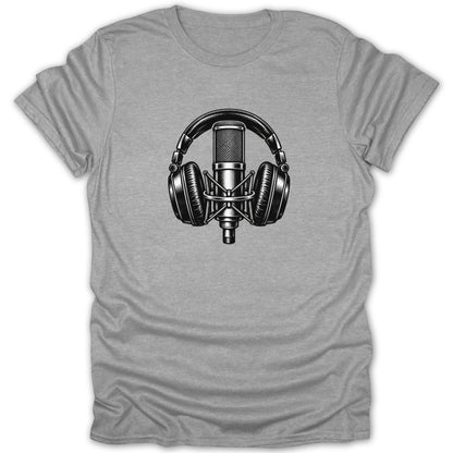 Black and white graphic of a vintage microphone with headphones on a grey t-shirt.