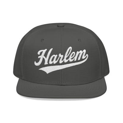 Dark grey baseball cap with white "Harlem" text embroidery.