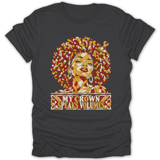 Dark grey t-shirt featuring a stained-glass style graphic of a Black woman with the text "MY CROWN SPEAKS VOLUMES".