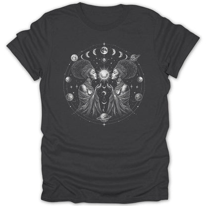 Two women with crowns face inwards creating a symmetrical design with celestial elements.