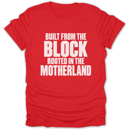 Bright red short-sleeved t-shirt featuring bold white text that reads, BUILT FROM THE BLOCK ROOTED IN THE MOTHERLAND.