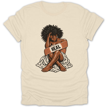 Woman with afro and band-aid reading "HEAL" across her chest.