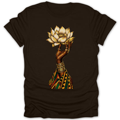 Brown t-shirt with a hand holding a lotus flower adorned with jewelry and patterned fabric.