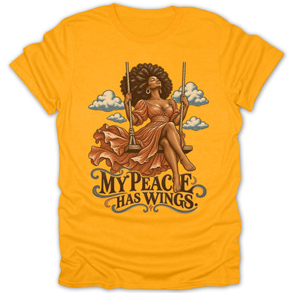 Woman with afro on swing with text "MY PEACE HAS WINGS."
