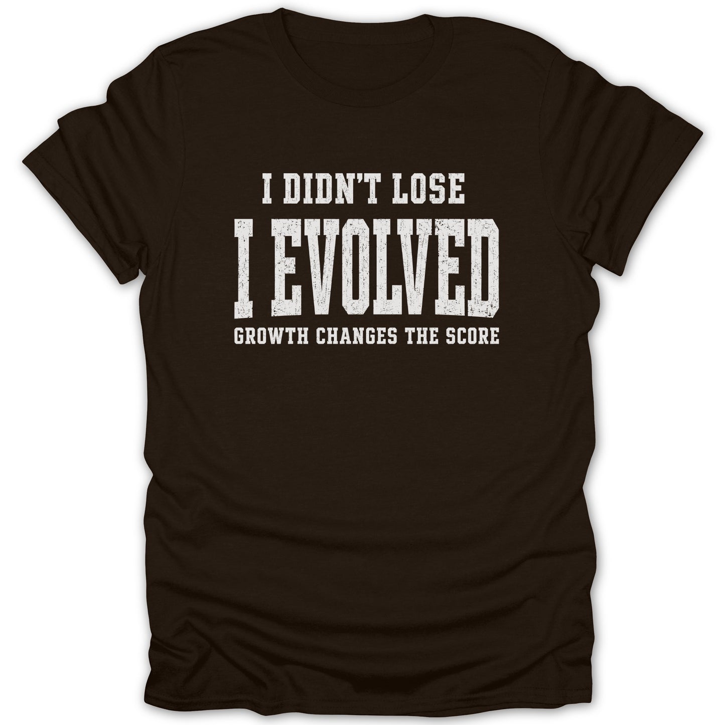 Brown t-shirt with text "I DIDN'T LOSE I EVOLVED GROWTH CHANGES THE SCORE"
