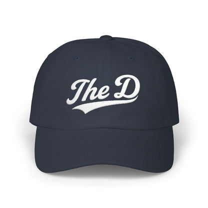 Navy blue baseball cap with "The D" embroidered in white script.