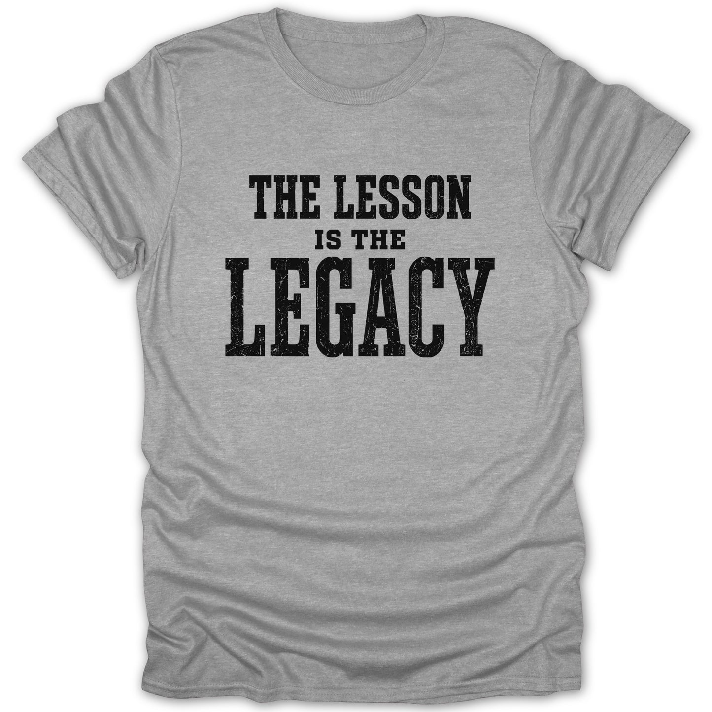 Gray t-shirt with black text "THE LESSON IS THE LEGACY".