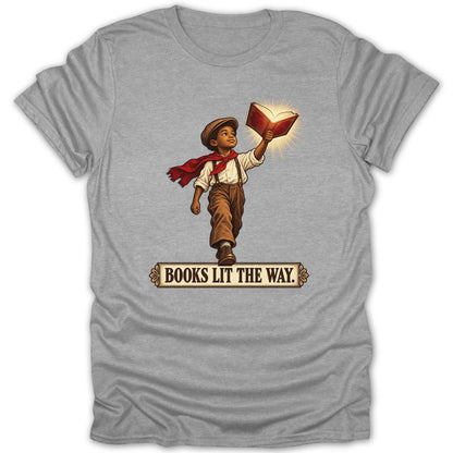 Boy in vintage clothing holds up glowing book with text "BOOKS LIT THE WAY."