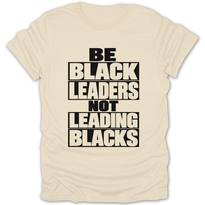 Be Black Leaders Not Leading Blacks text on a cream t-shirt.