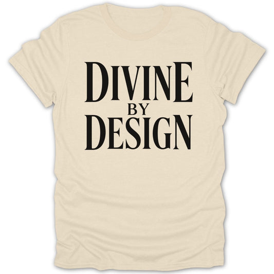 Cream t-shirt with black text that reads "DIVINE BY DESIGN".